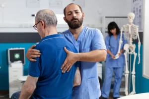 Nurse stretching patients spinal cord