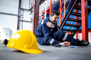 Factory worker fell down and injured shoulder at work.